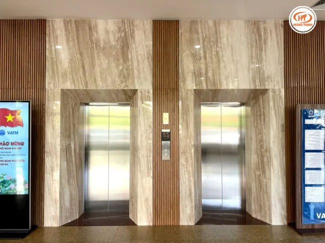 Đá vân gỗ tự nhiên ốp thang máy sang trọng