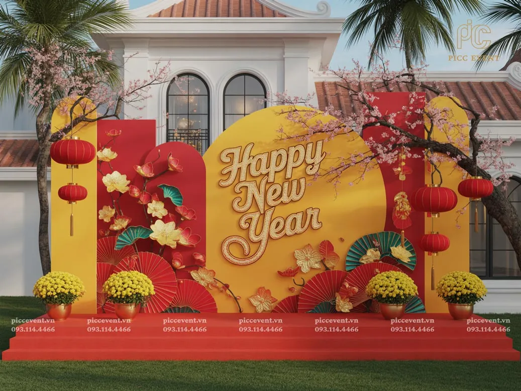 Mẫu trang trí tết công ty với cổng chào hoa mai vàng và backdrop đỏ