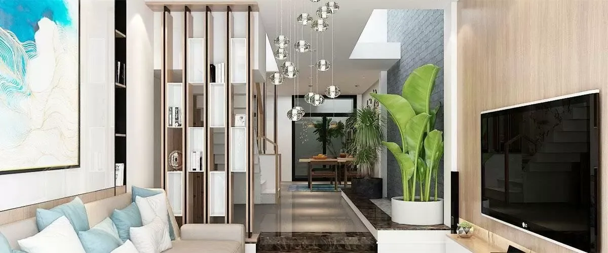 Vách ngăn phòng khách và bếp có kệ trang trí